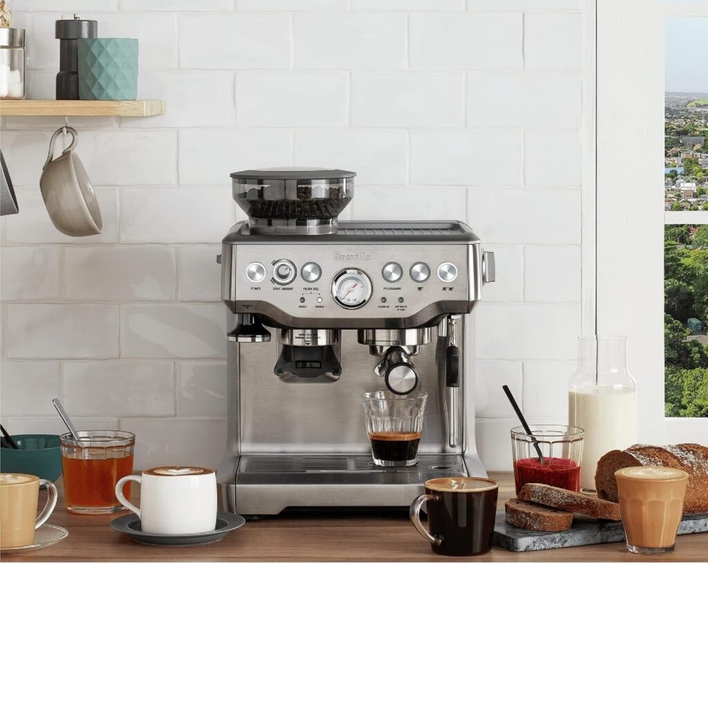 Breville Barista Express espresso machine pulling a shot on a kitchen counter