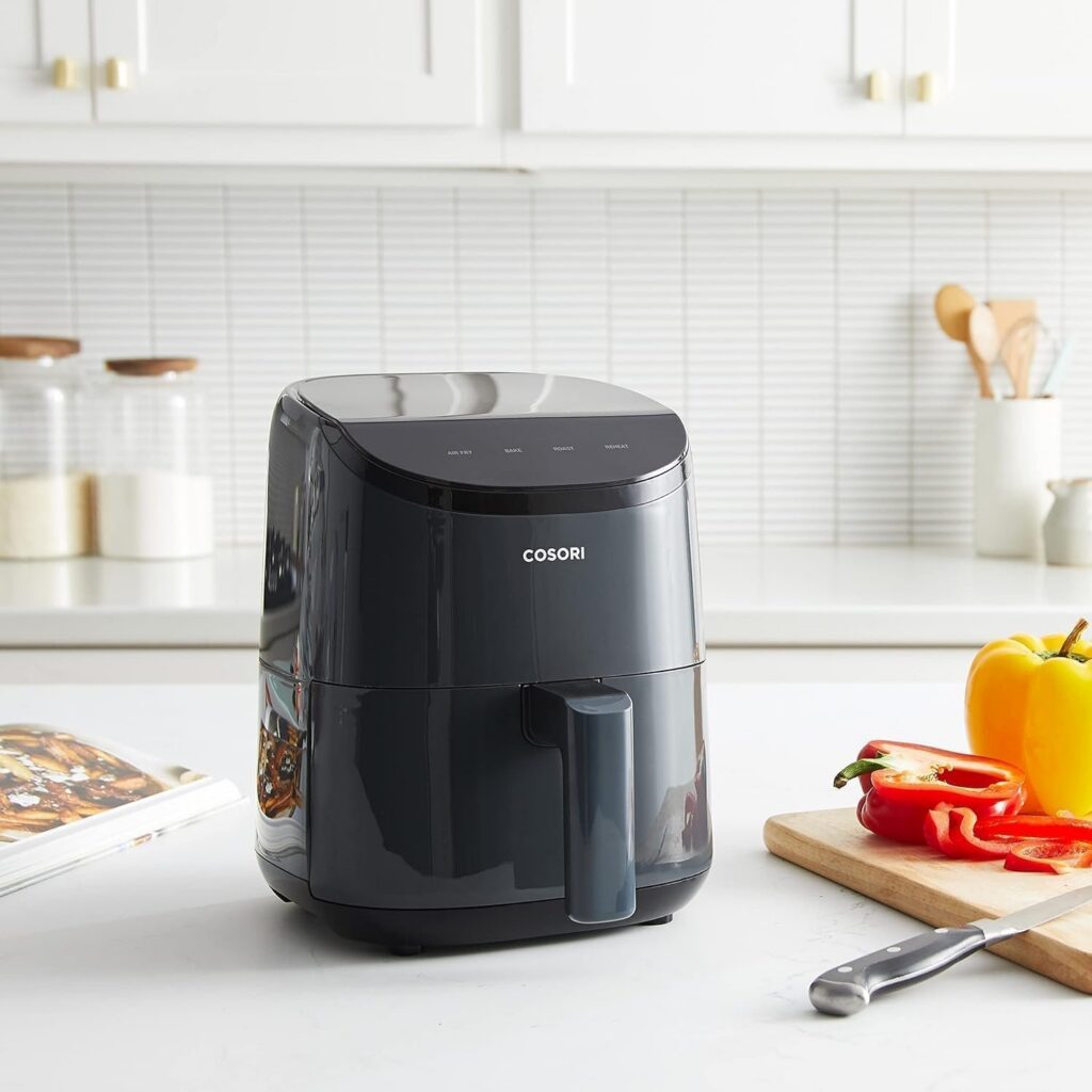 Cosori Lite 2.1-quart mini air fryer in gray on a kitchen counter